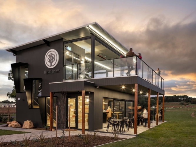 Haselgrove wines cellar door building from the front showcasing the rooftop and lower level at dusk